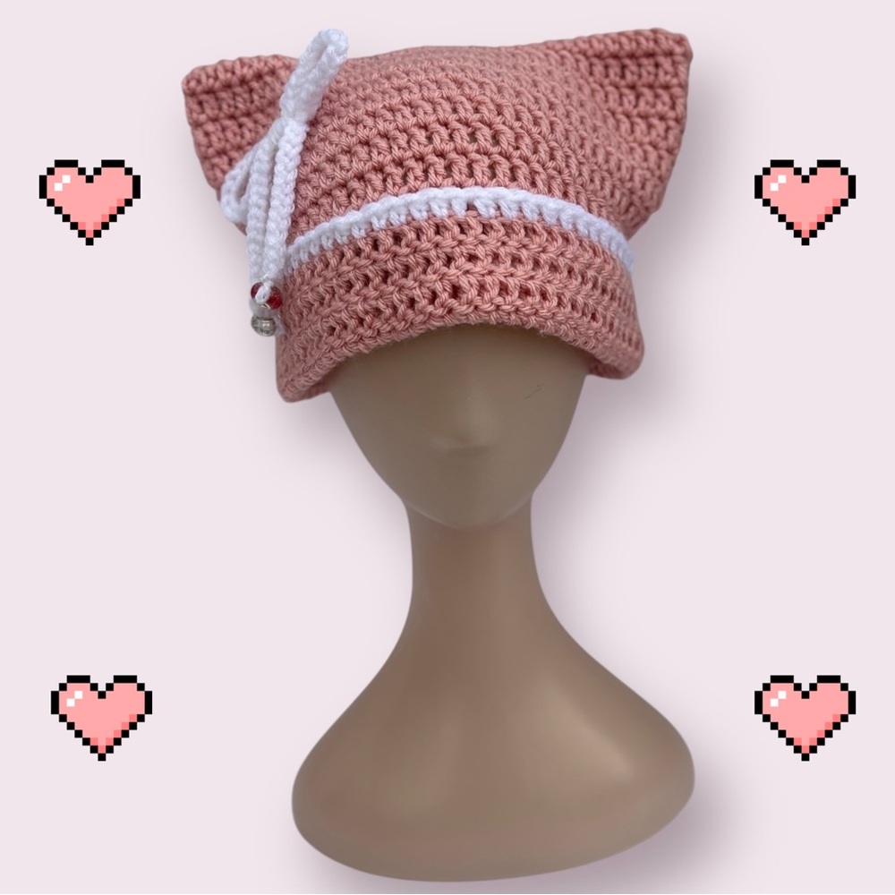 Pink and white crochet cat beanie with bow and beads, folded brim